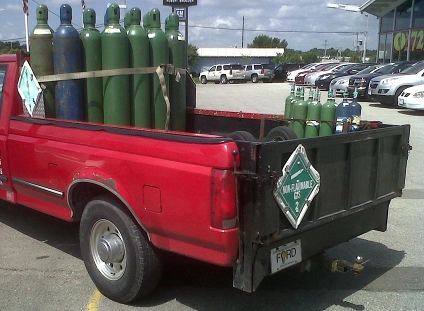 Hazmat truck with compressed gas cylinders